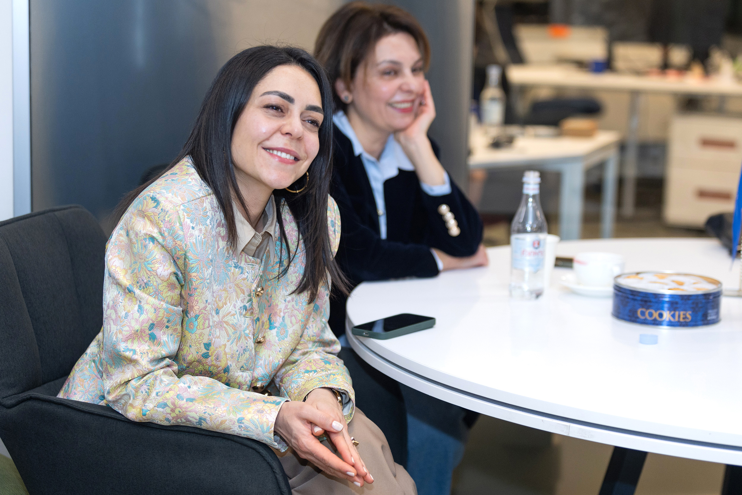 Two participants of event are listening