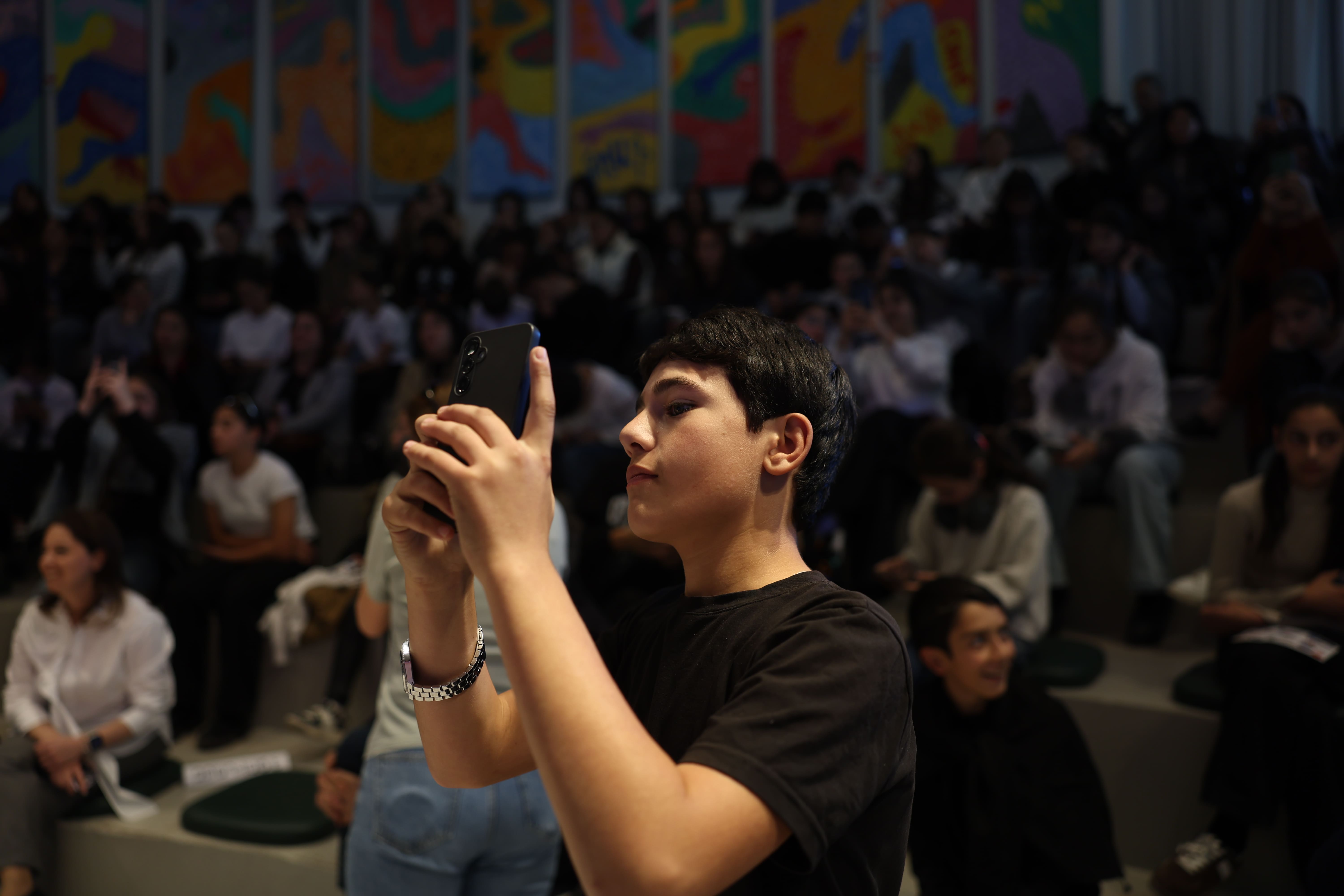 Child is taking photo of cybersecurity material