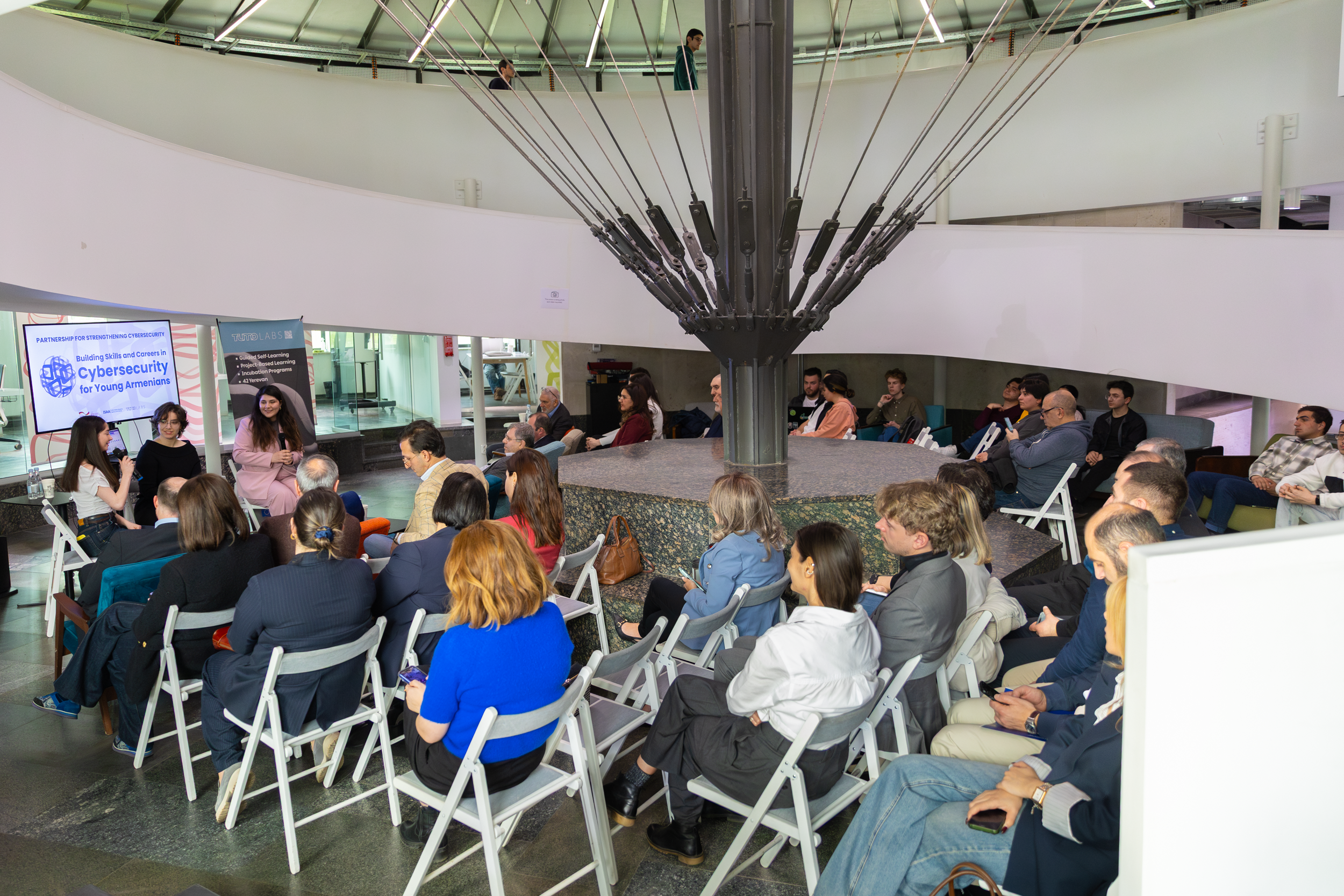 TUMO Labs, sitting people during an event