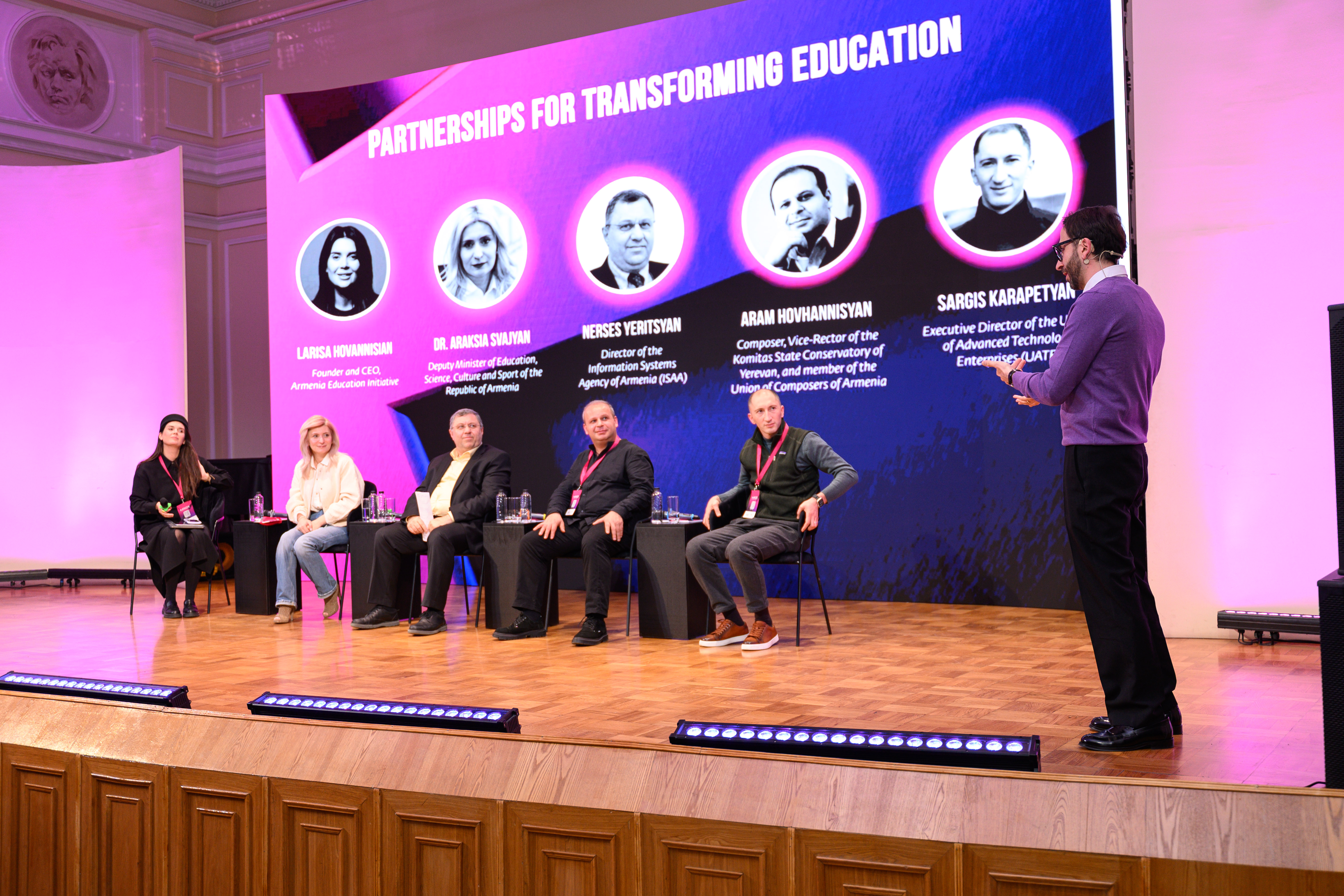 Photo from panel discussion, 4 sitting people