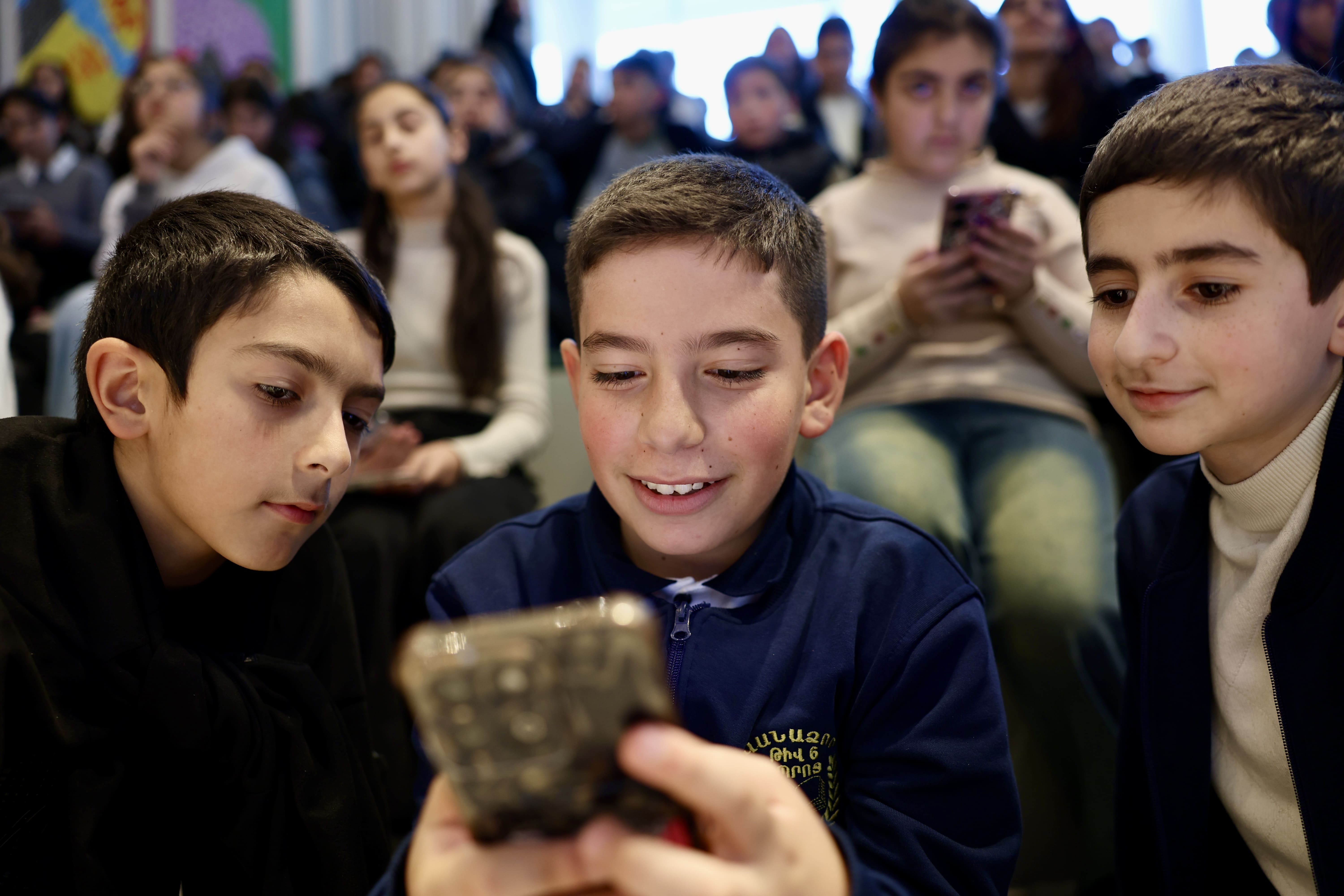 Curious children during cybersecurity awareness campaign
