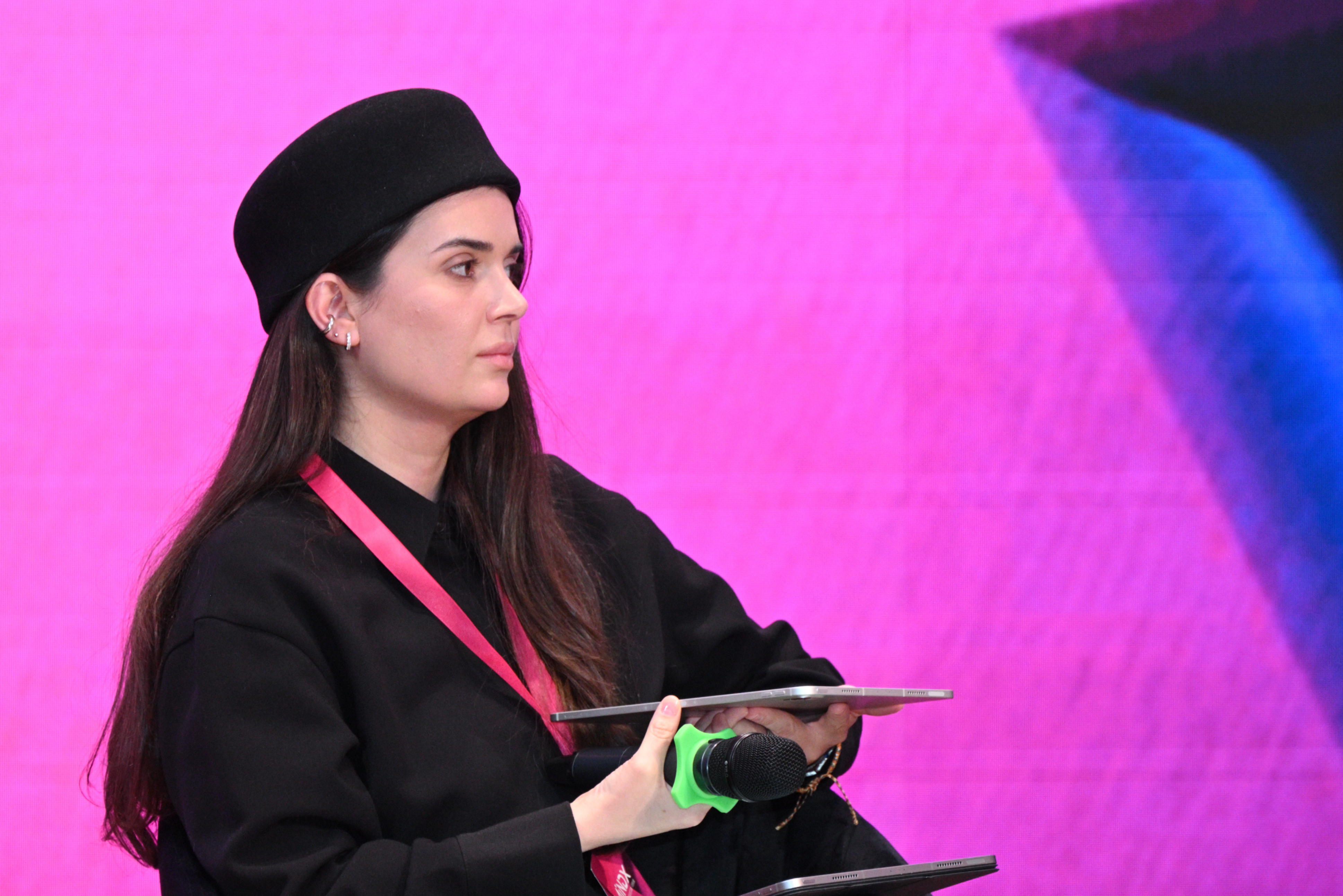 Moderator of panel discussion is sitting